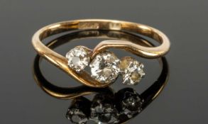 DIAMOND THREE-STONE RING set with three old round-cut diamonds totalling approx. 0.25ct, set in