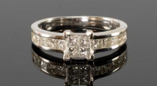 18CT WHITE GOLD DIAMOND RING, square-set with four princess-cut diamonds to pavé-set princess-cut