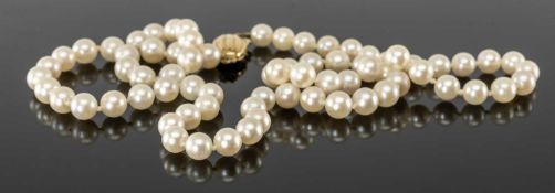SINGLE-STRAND CULTURED PEARL NECKLACE, possibly by Mikimoto, 9ct gold oval clasp, 47cms (l)