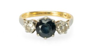 SAPPHIRE & DIAMOND THREE-STONE RING centred with a round-cut sapphire of approx. 1ct, flanked with