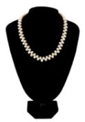 CULTURED PEARL NECKLACE, the ovoid-shaped pearls zigzag strung, silver ball clasp stamped 925, 47cms