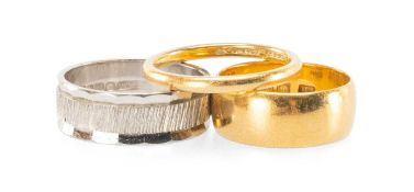 THREE GOLD RINGS, comprising 22ct narrow wedding band, 2.8g; 22ct broad wedding band, 6.1g; and 18ct