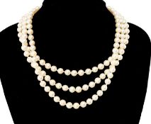 THREE-STRAND CULTURED PEARL NECKLACE on oval 9ct gold split pearl & cabochon amethyst clasp,