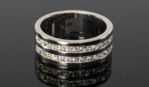 PRINCESS DIAMOND HALF-ETERNITY RING in 950 standard platinum, channel set with two rows of small