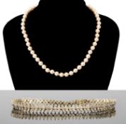DIAMOND LINE BRACELET in 9ct gold, set with 68 tiny brilliants, illusion set, 19.5cms (l), 7.6g; and