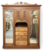 GOOD EDWARDIAN MAHOGANY TRIPLE WARDROBE, central drawers, two end mirrored glass doors, 223 (h) x