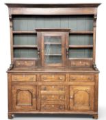 NORTH WALES WELSH DRESSER, circa 1900, the rack with unusual small central glazed door, three