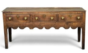 18TH CENTURY OAK SHROPSHIRE DRESSER BASE with three drawers and shaped apron, 80 (h) x 104 (w) x