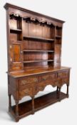 LATE 18TH CENTURY STYLE OAK WELSH DRESSER, shaped frieze below dentil cornice, boarded plate rack