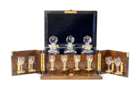 BURR WALNUT TANTALUS BOX-CABINET, fold-out cabinet with brass hinges and a Bramah lock, lined with