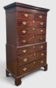 19TH CENTURY MAHOGANY CHEST-ON-CHEST, moulded dentil cornice above blind fretwork frieze, brass