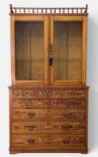 LATE 19TH CENTURY PITCH PINE BOOKCASE, galleried upper section with glazed doors, two fixed glass