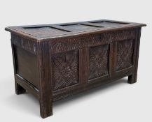18TH CENTURY STYLE JOINED OAK COFFER, three-panel lid and front with ornate carved floral