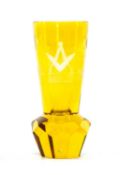 MASONIC INTEREST: AMBER GLASS FIRING GLASS, the bowl engraved with Masonic symbols, on tapered