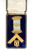 MASONIC INTEREST: 9CT GOLD PRESENTATION JEWEL, the pale blue ribbon with three bars engraved '