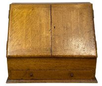 EDWARDIAN OAK STATIONERY BOX, sloping front with twin doors opening to reveal pigeonholes, with a