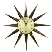 METAMEC GILT METAL-CASED 'STARBURST' WALL CLOCK, quartz movement, dial signed and with Arabic