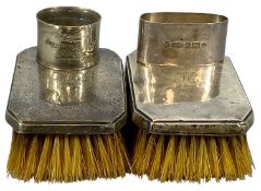 TWO SILVER NAPKIN RINGS, one oval and one circular, and a pair of silver-backed hairbrushes