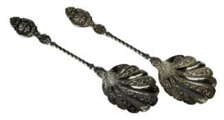 PAIR OF VICTORIAN SILVER SERVING SPOONS, repoussé decorated shaped bowls, twist stems and mask