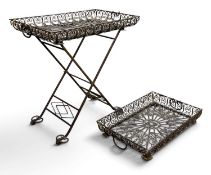 TWO ORNATE RETICULATED METAL TWO-HANDLED TRAYS, 65 x 43cms the largest; and a folding stand,