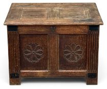 OAK COFFER BACH late 19th Century, two carved rosette front panels and iron handles, 49 (h) x 66 (w)