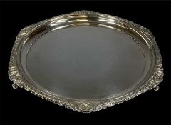 CIRCULAR SILVER WAITER with gadrooned and shell cast border, on three pad feet, hallmark rubbed,
