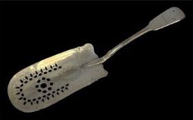 GEORGE III SILVER FISH SLICE, pierced blade engraved with laurel wreath, handle with dragon crest,