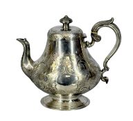 VICTORIAN SILVER TEAPOT of circular form, with floral and scroll engraved decoration, leaf-capped