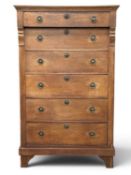 NARROW CHEST OF SIX DRAWERS, circa 1900, with brass ring handles and escutcheons, on bracket feet,