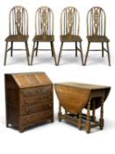 EDWARDIAN OAK BUREAU with drop-down top, carved front drawer and three other drawers, 93 (h) x 74 (