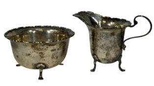 GEORGE V SILVER MILK JUG & SUGAR BASIN with shaped rims, each on three pad feet, Oldfield Ltd.,