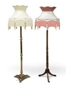 TWO ANTIQUE TYPE STANDARD LAMPS with fancy tasselled shades, one Corinthean columned brass and the