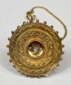 VICTORIAN ETRUSCAN REVIVAL 15CT GOLD BROOCH with bead rim and central diamond, with safety chain,