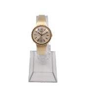 A 14ct gold Rolex ladies' cocktail watch, with a silvered dial, rope style bezel, baton hours