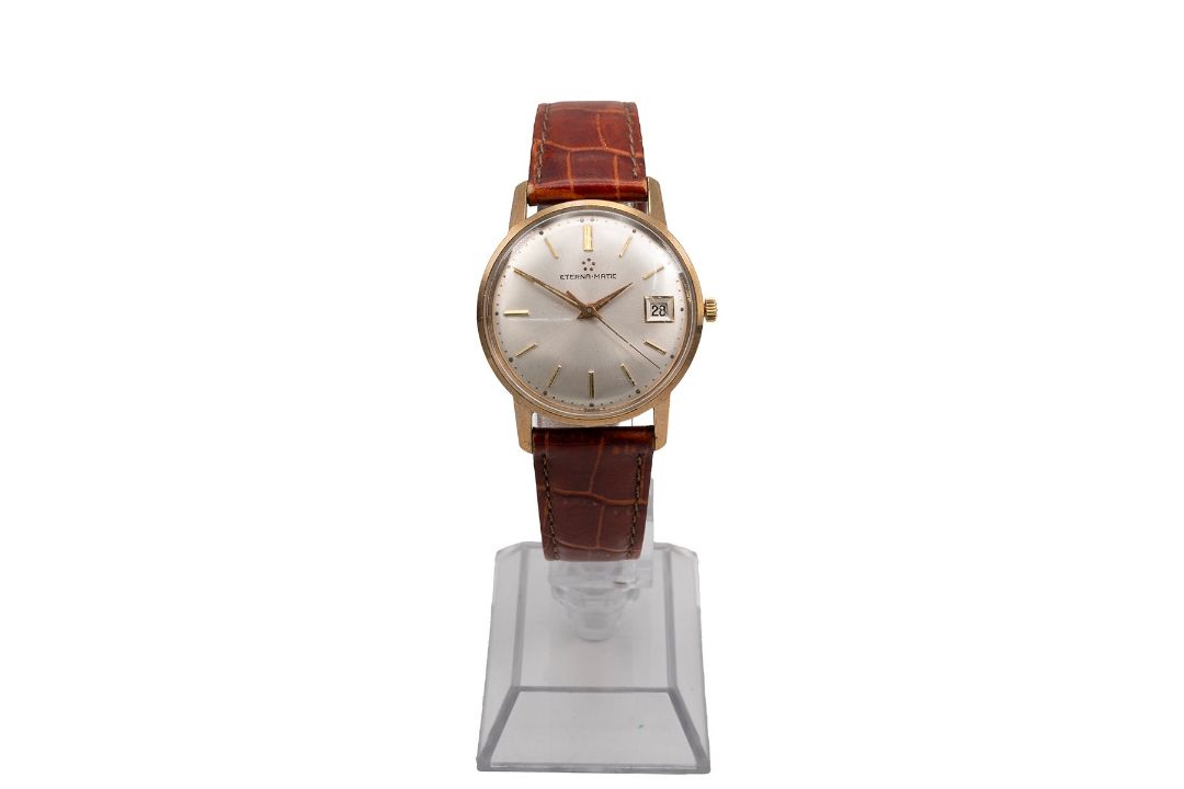 147 Hours A vintage 9ct gold Eterna-matic wristwatch, with hour makers, silvered ...