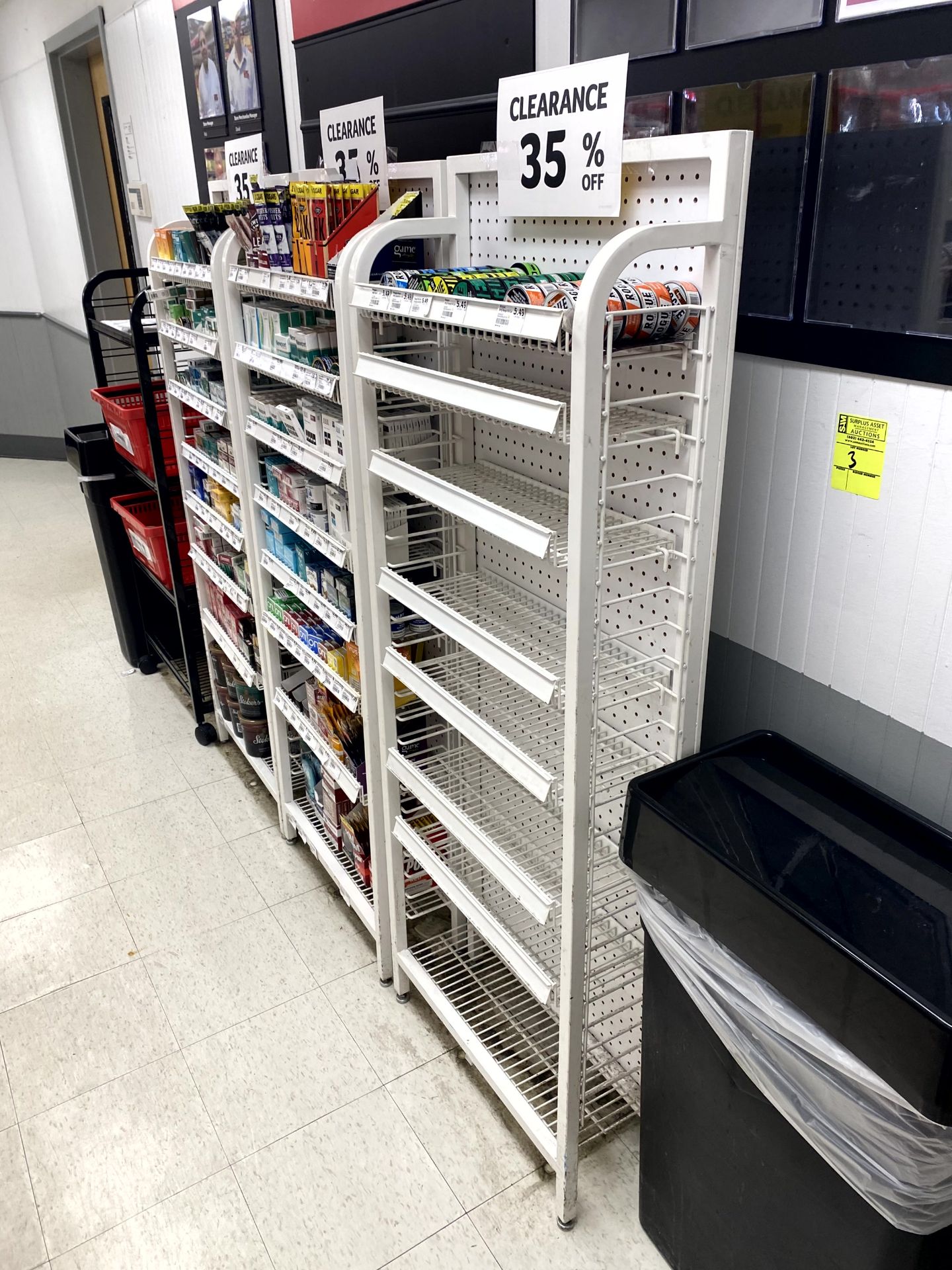 NARROW MERCHANDISERS BEHIND CUSTOMER SERVICE DESK