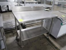 stainless table w/ backsplash & undershelf, on casters