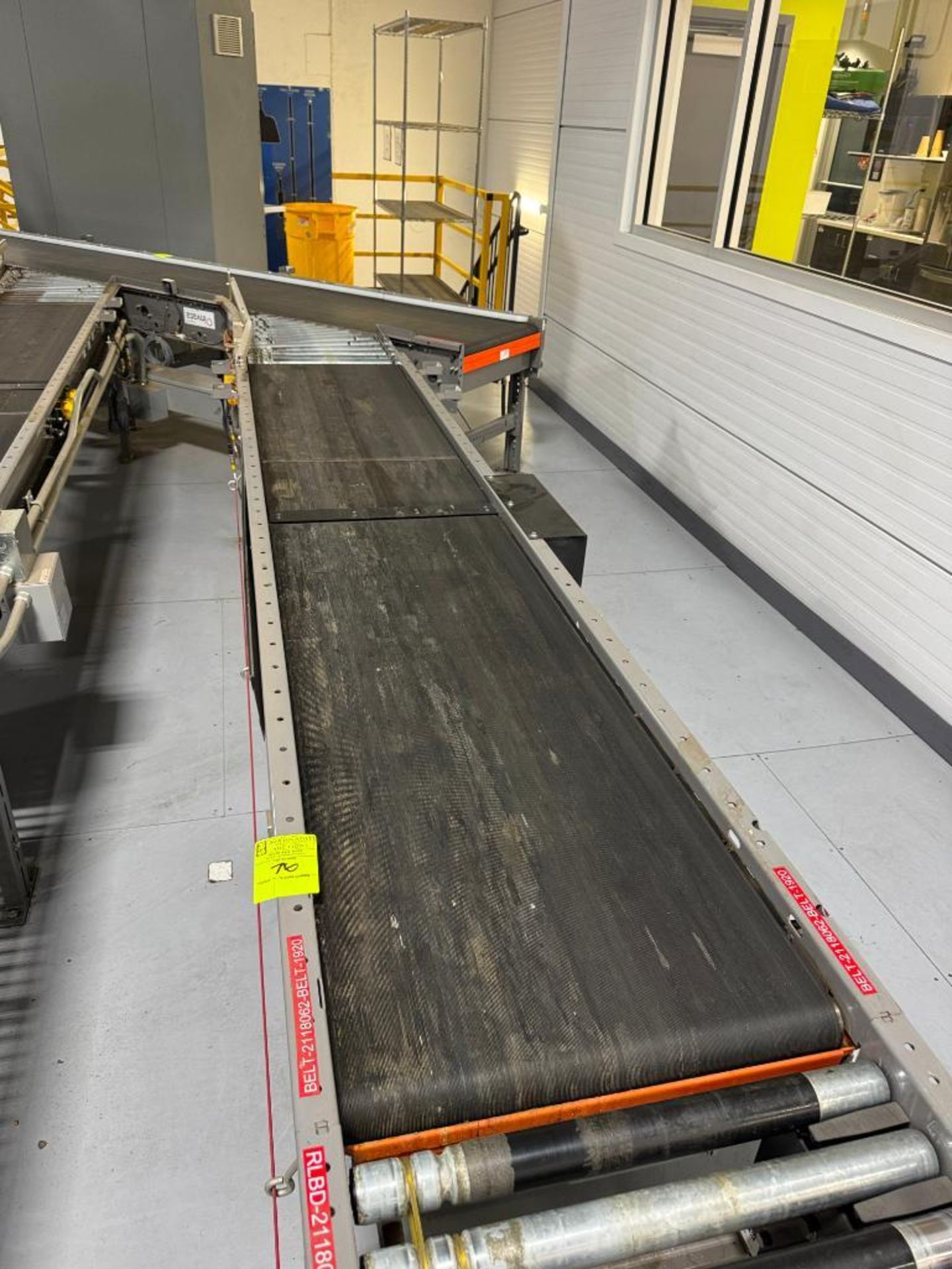 Invata conveyor belt w/ powered rollers joins second belt