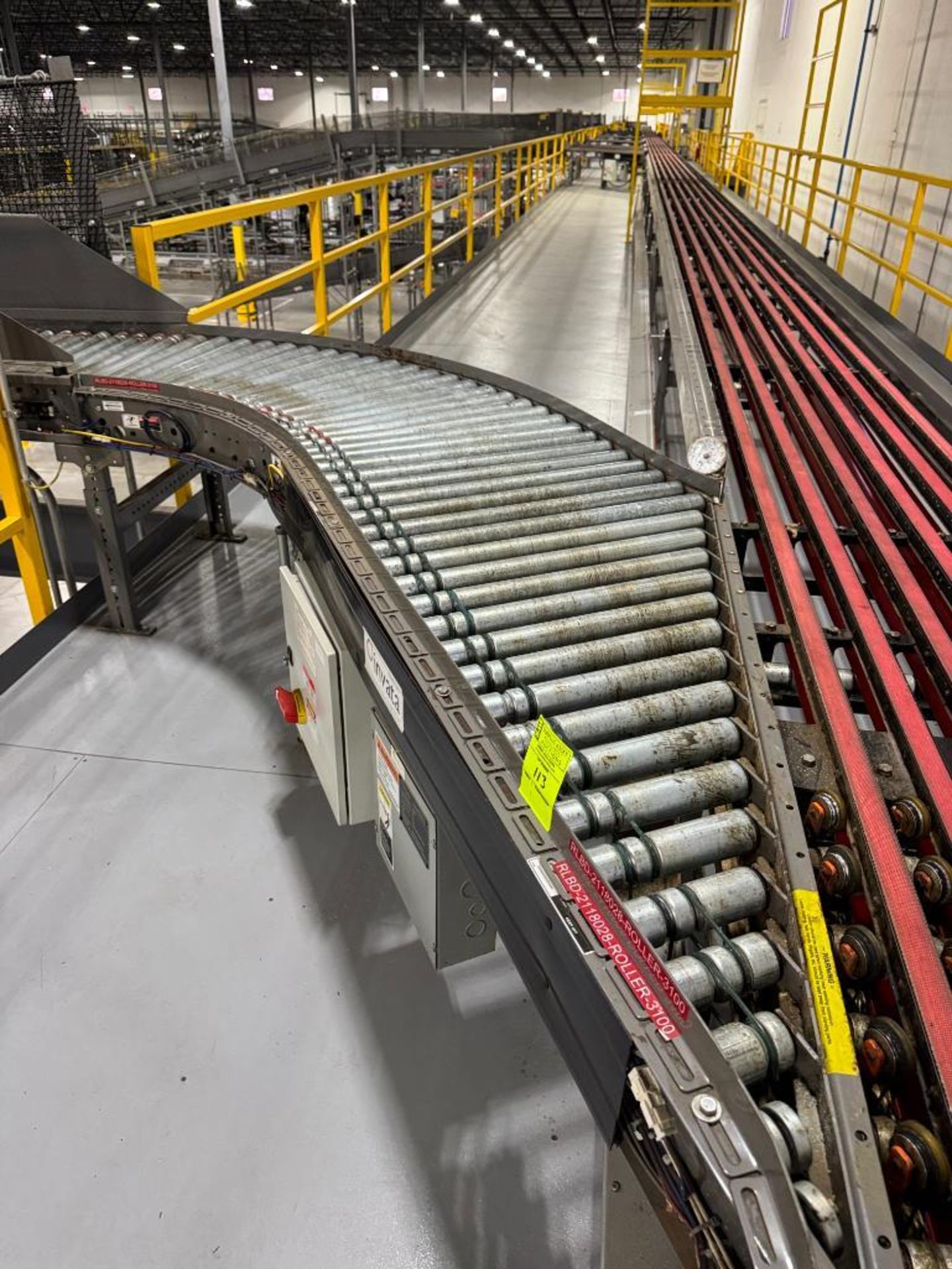 Invata partially powered roller conveyor, on ~16' uprights