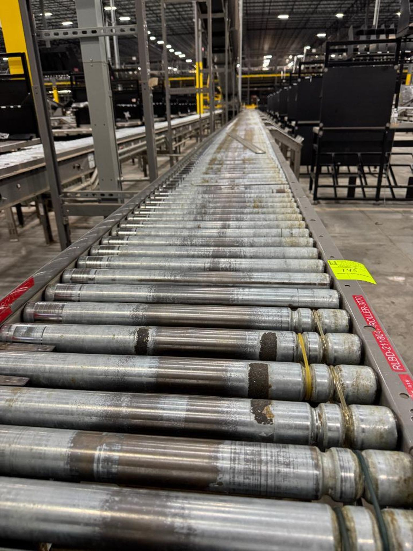 Invata partially powered roller conveyor w/ pack stations