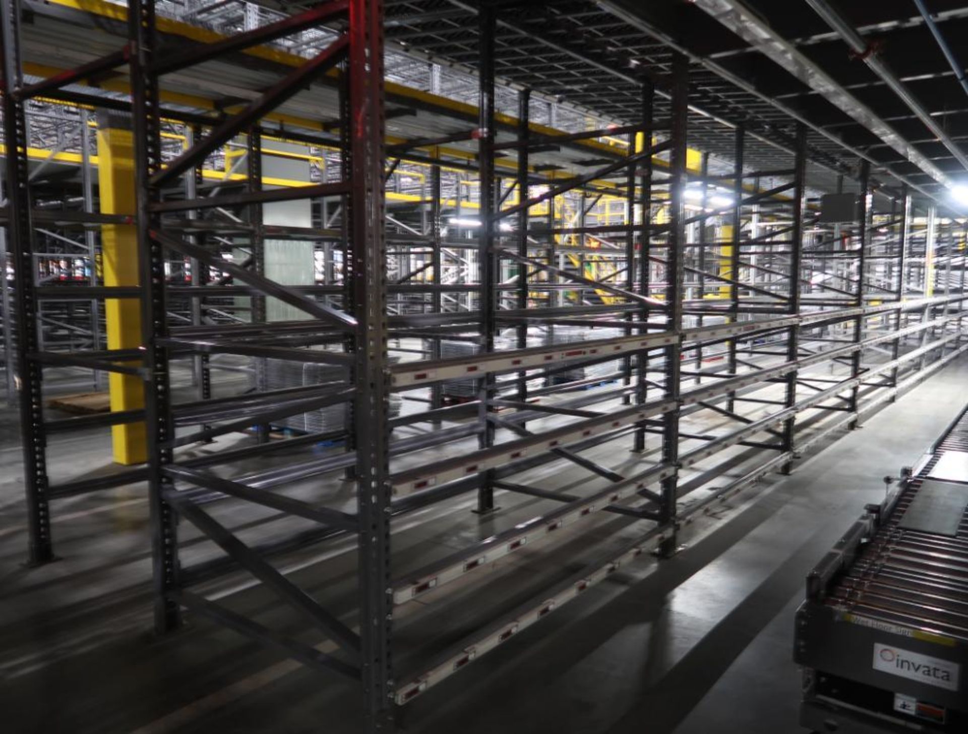 11) sections of pallet racking w/ gravity flow rollers