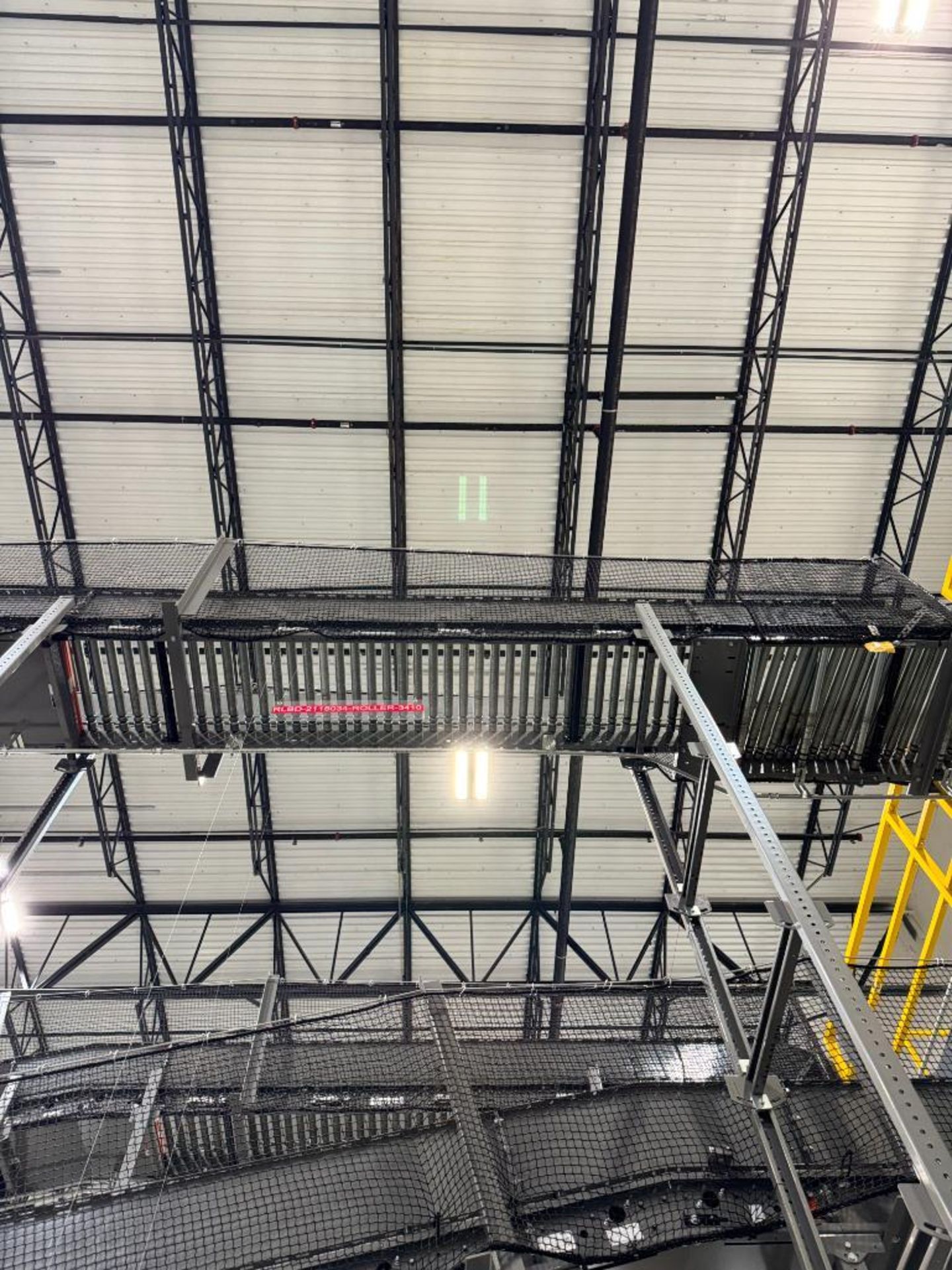 Invata partially powered roller conveyor, on ~16' uprights