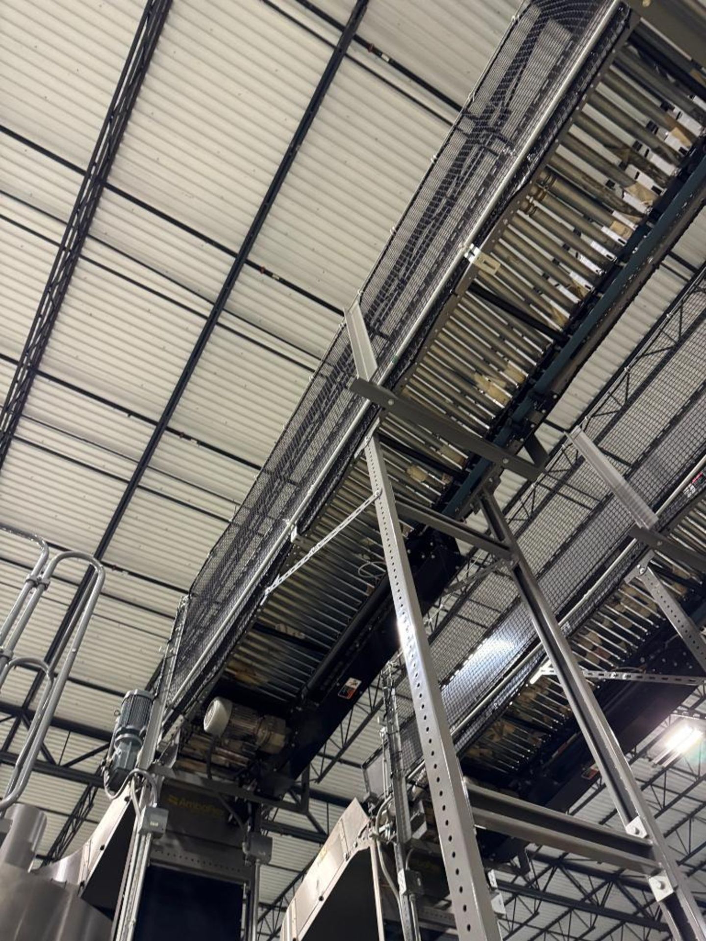Invata partially powered roller conveyor, on ~16' uprights