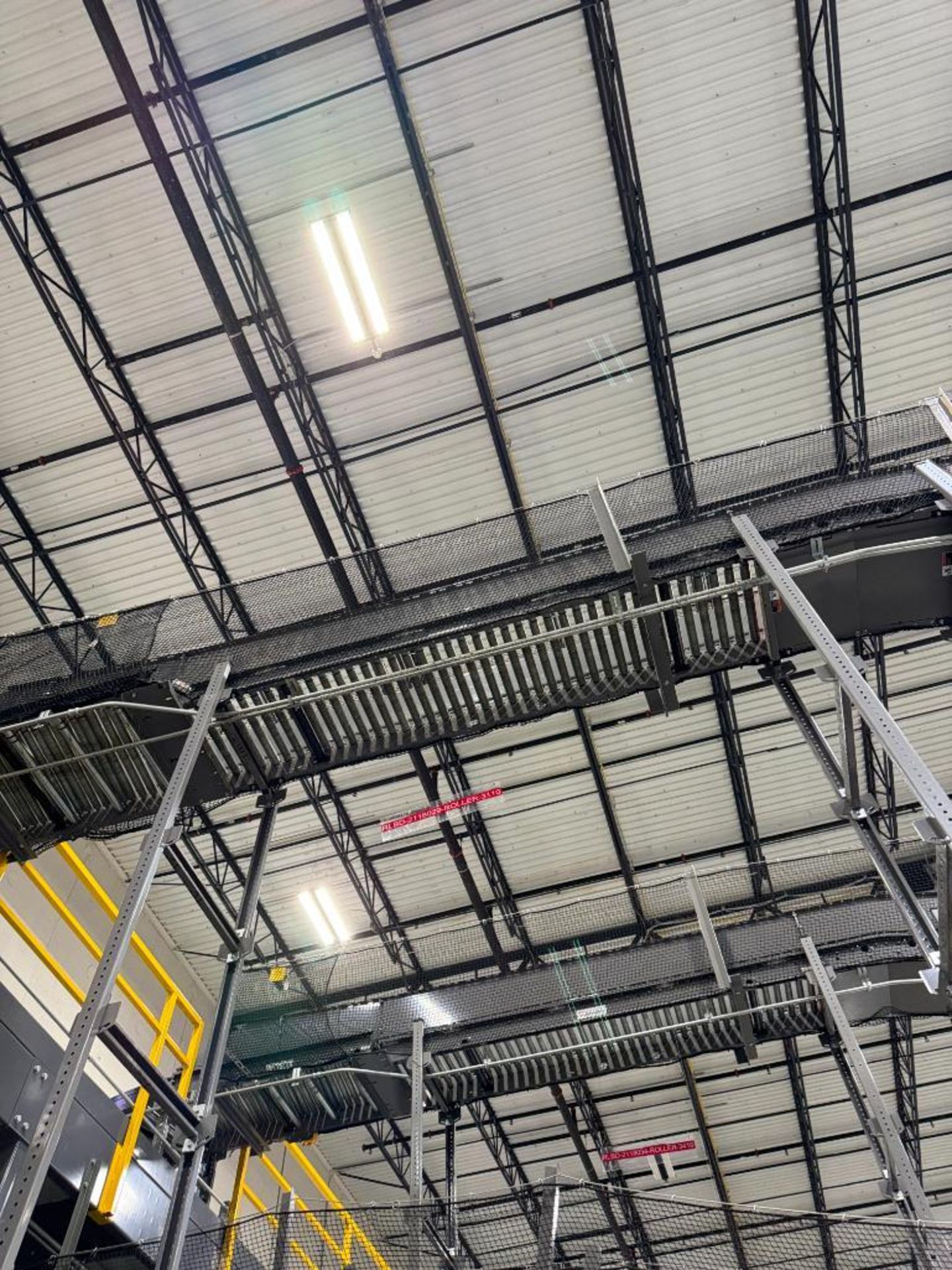 Invata partially powered roller conveyor, on ~16' uprights
