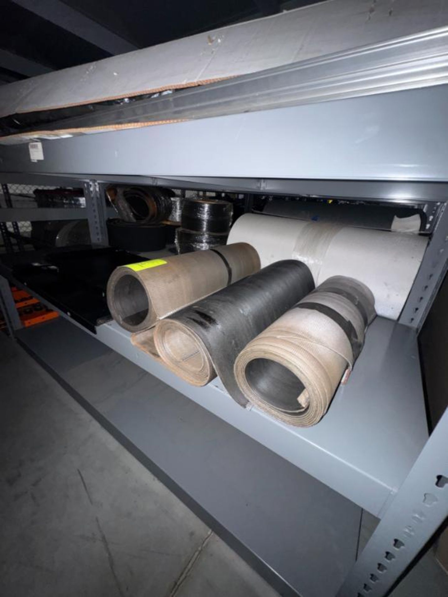 contents of warehouse racks- conveyor belts, roller bars,