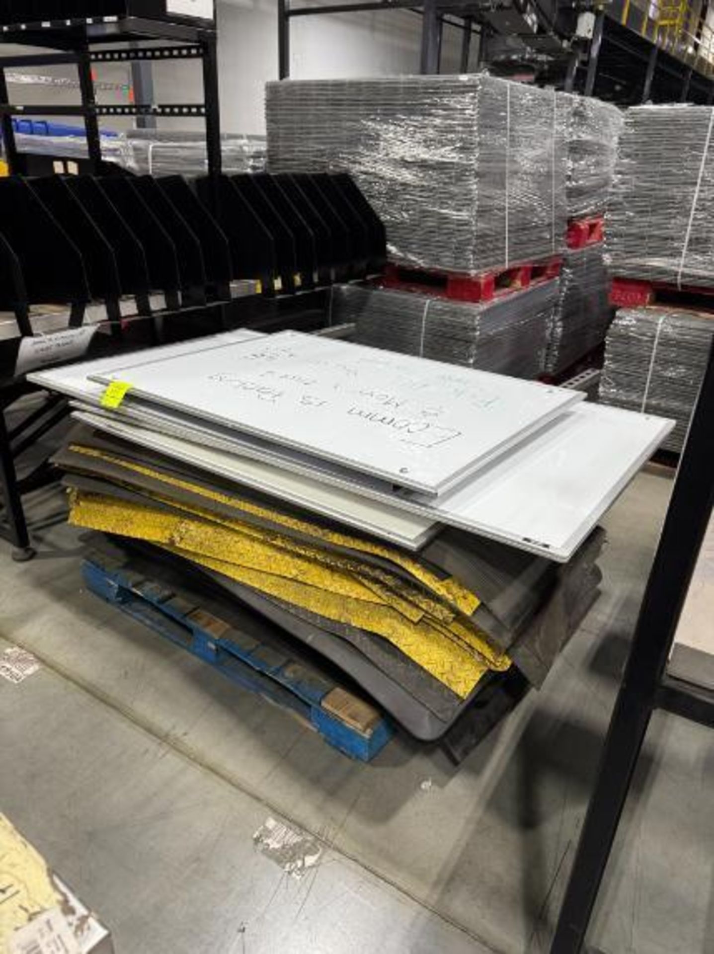 pallet of floor pads & white boards