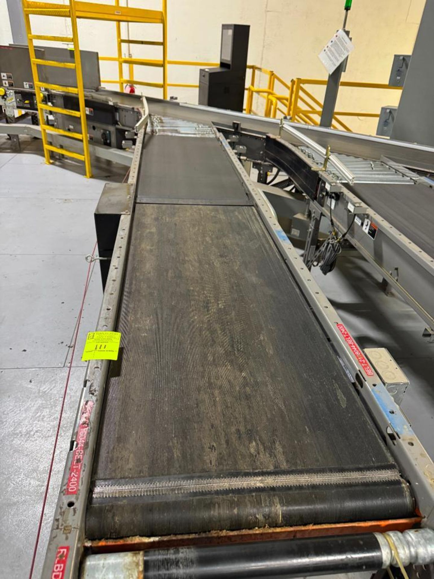 Invata conveyor belt w/ powered rollers joins second belt