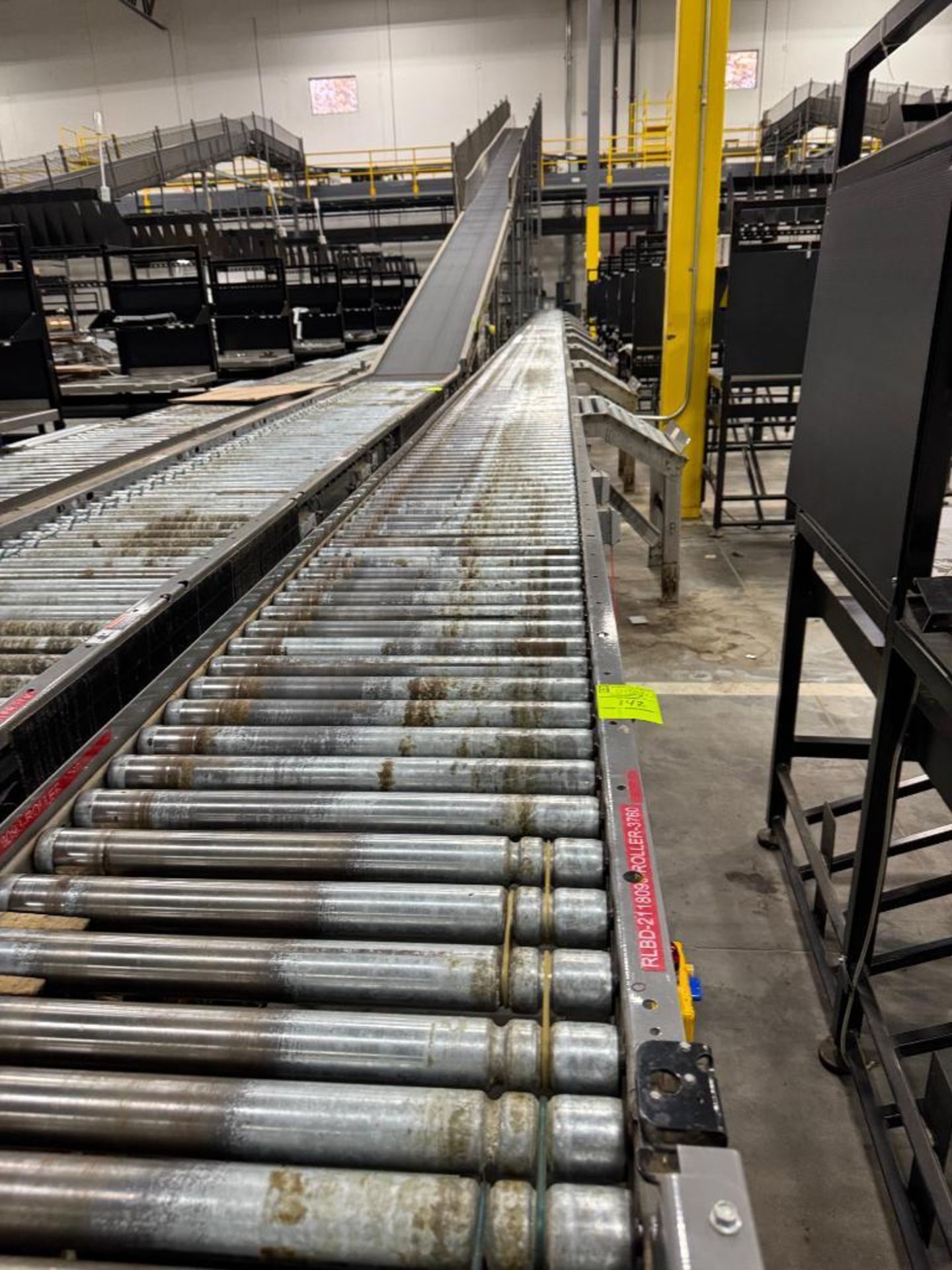 Invata partially powered roller conveyor w/ pack stations
