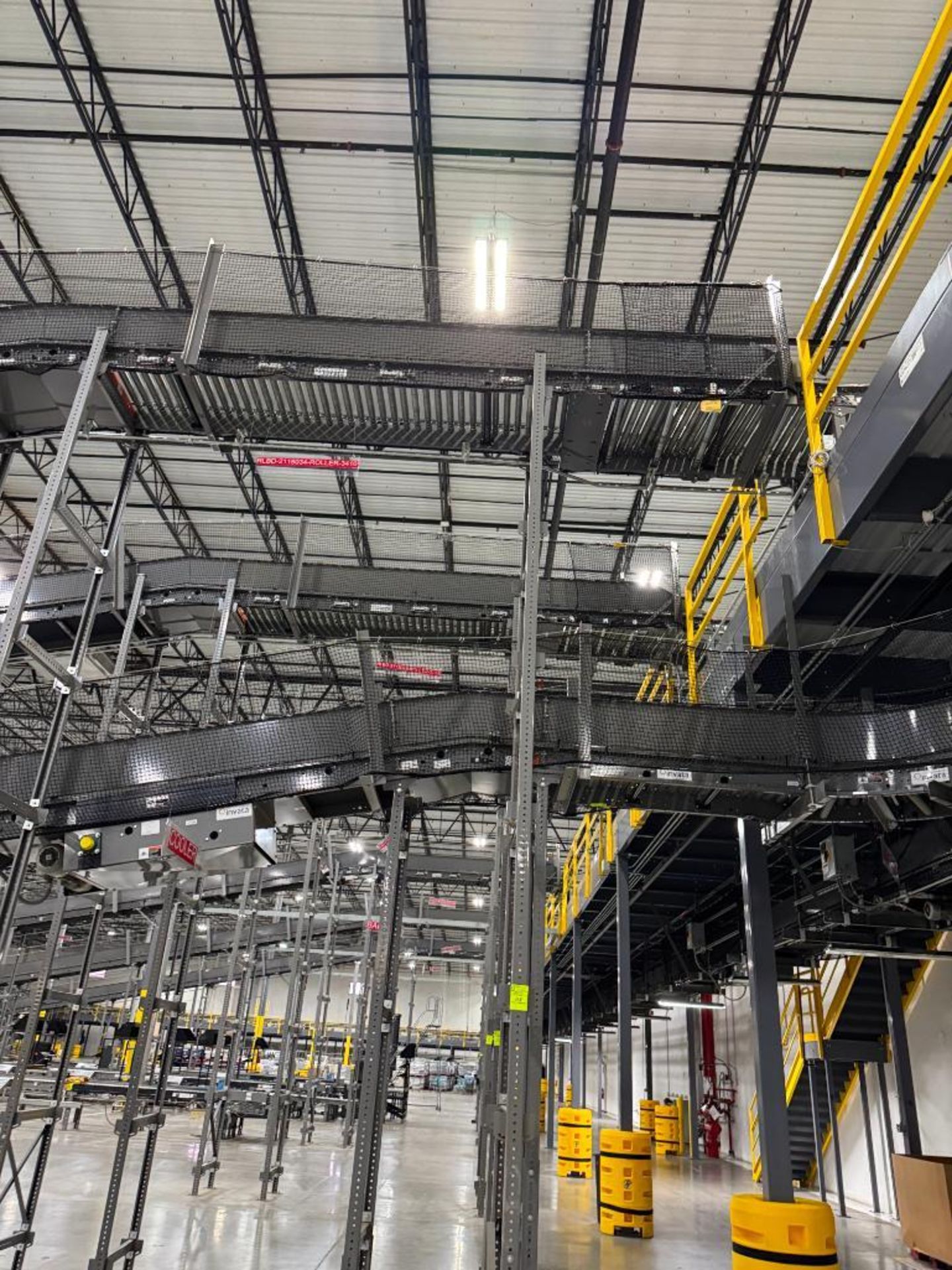Invata partially powered roller conveyor, on ~16' uprights - Image 2 of 3