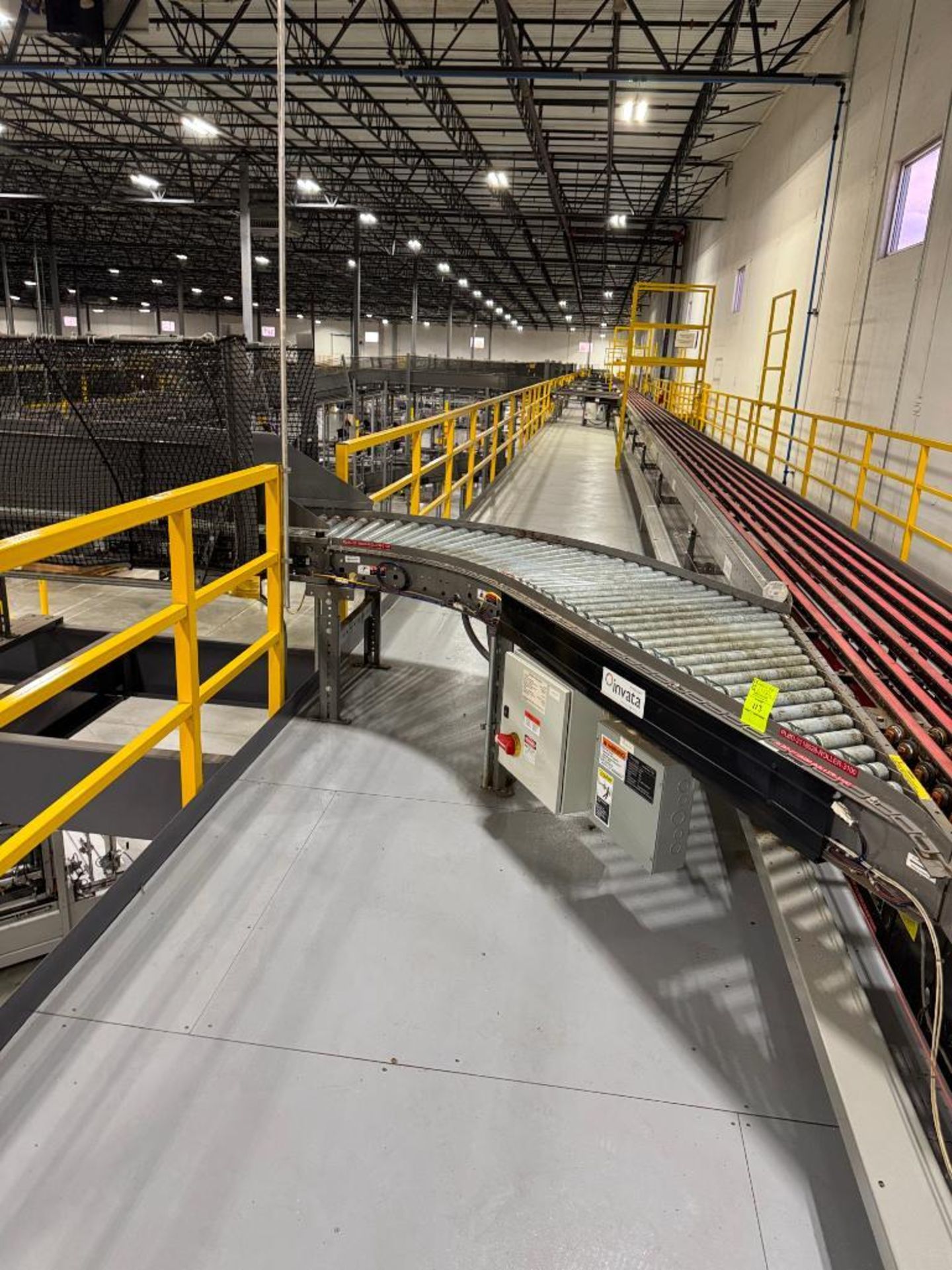 Invata partially powered roller conveyor, on ~16' uprights - Image 4 of 6